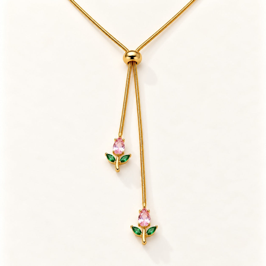 Tulip Lariat Necklace by NuNu: a slider chain with a pink tulip at each end, anti-tarnish gold tone
