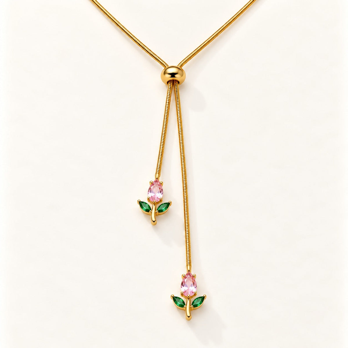 Tulip Lariat Necklace by NuNu: a slider chain with a pink tulip at each end, anti-tarnish gold tone