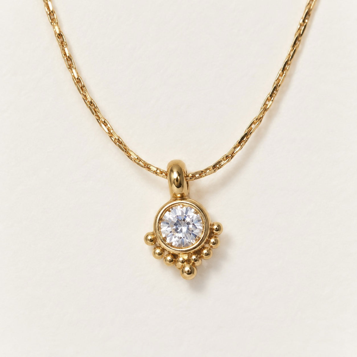 Crystal Dot Necklace product photo on cream