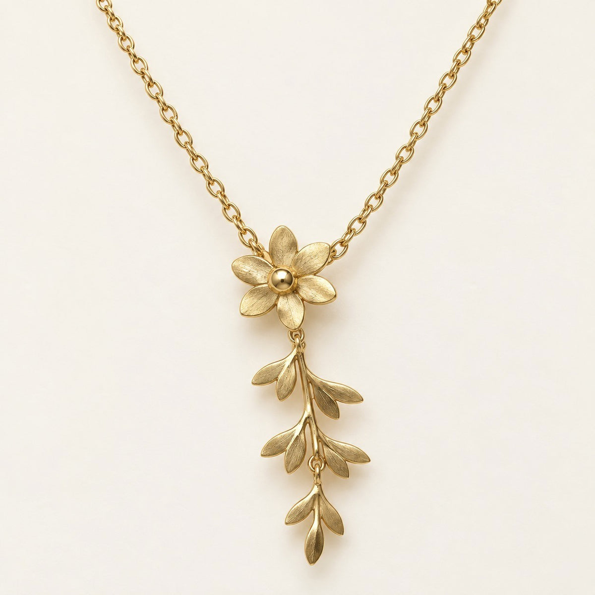 Flower Sprig Lariat Necklace product photo on cream