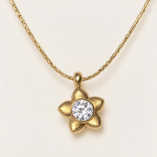Golden Blossom Necklace product photo on cream