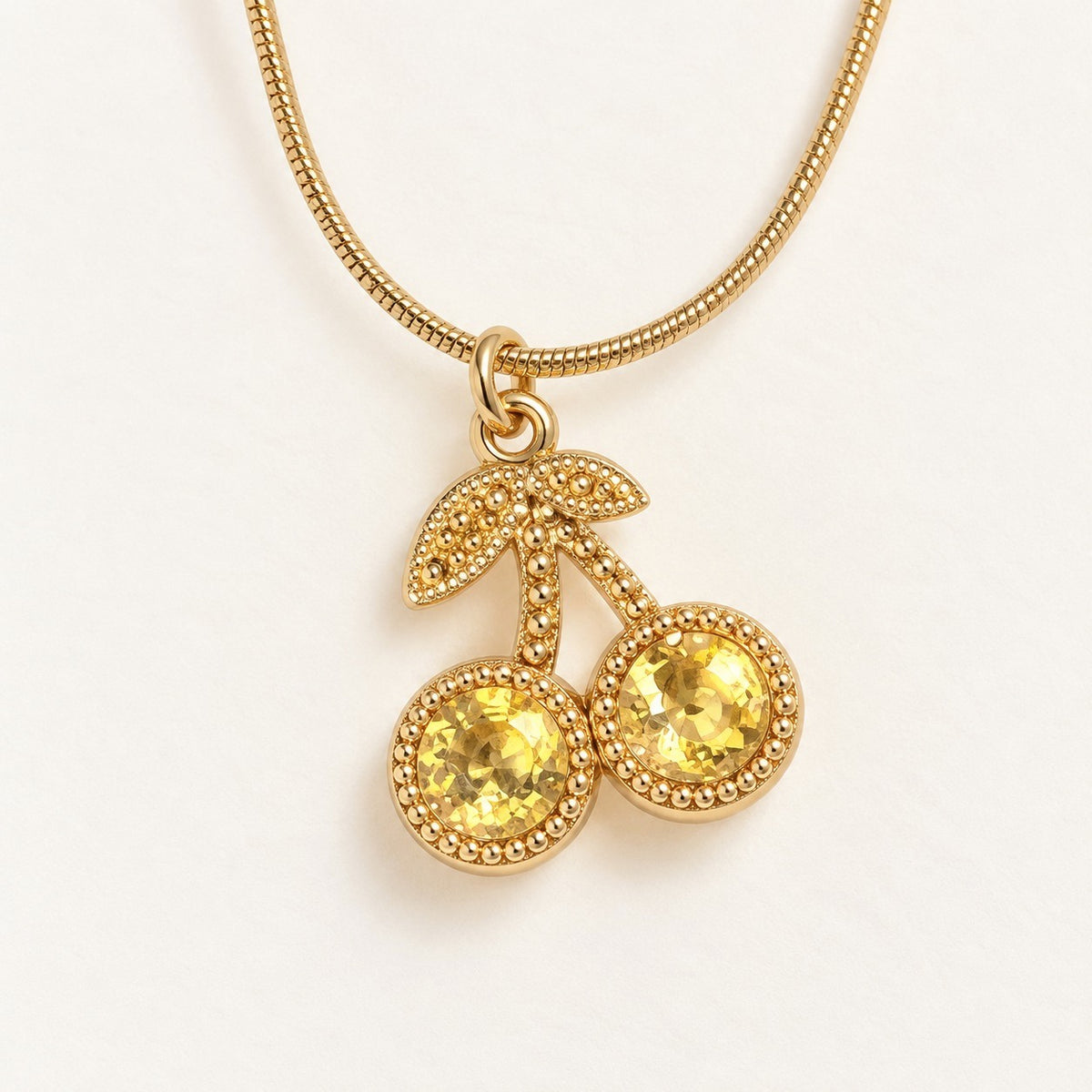 Golden Cherry Necklace product photo on cream