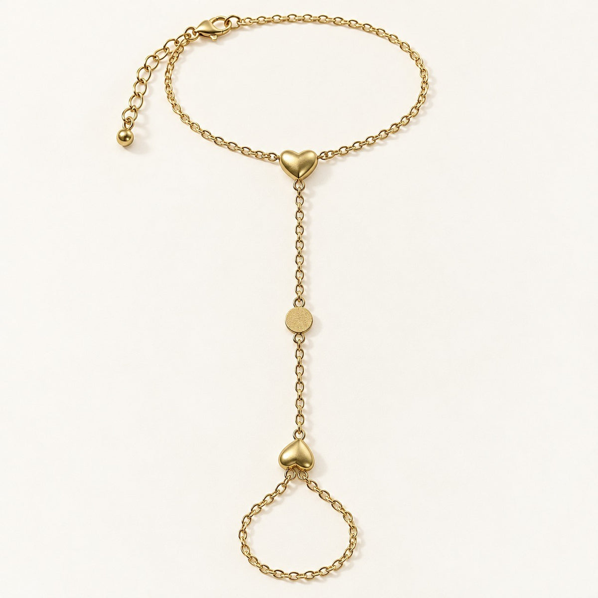 Golden Heart Hand Chain product photo on cream