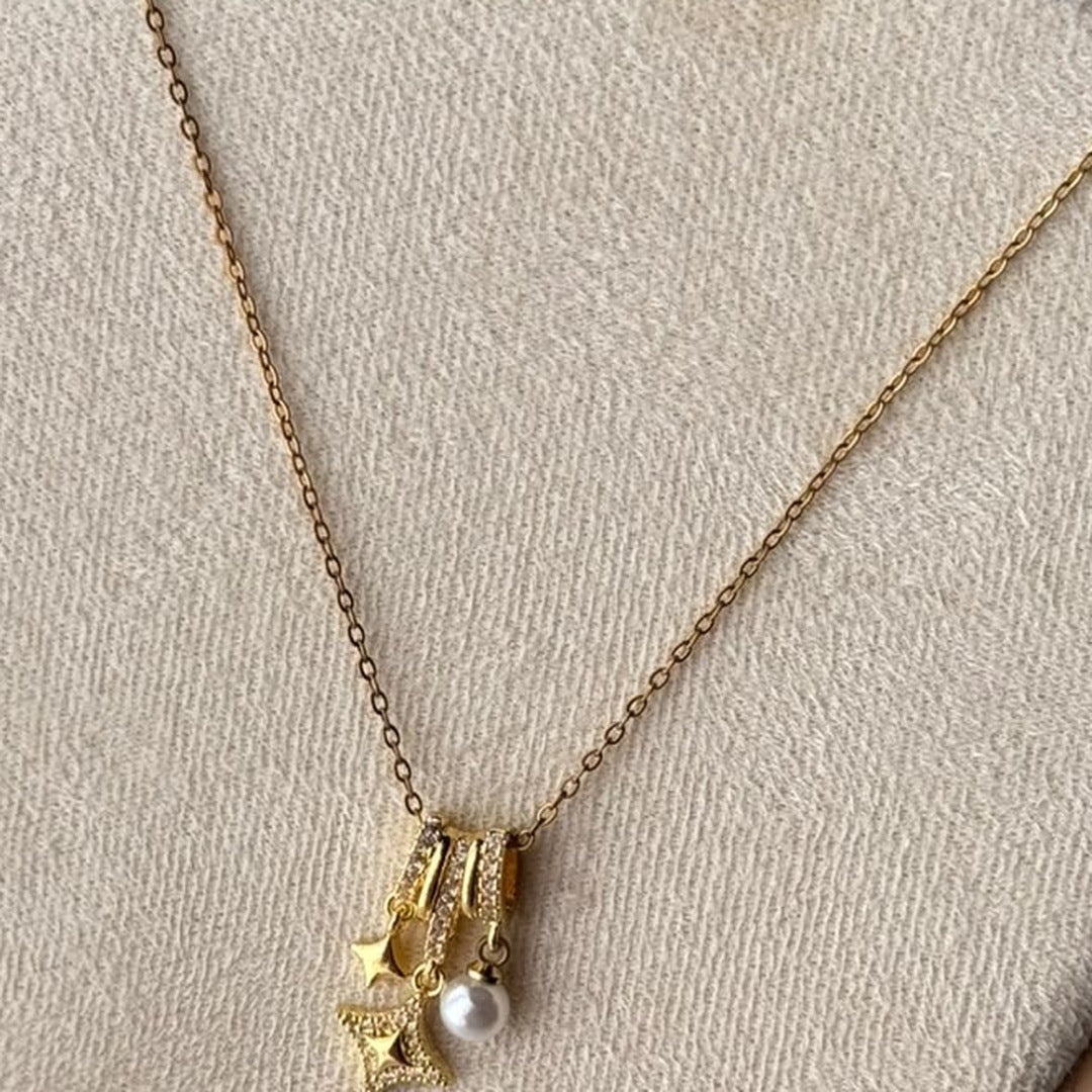 Star Pearl Charm Necklace – real photo on cream velvet