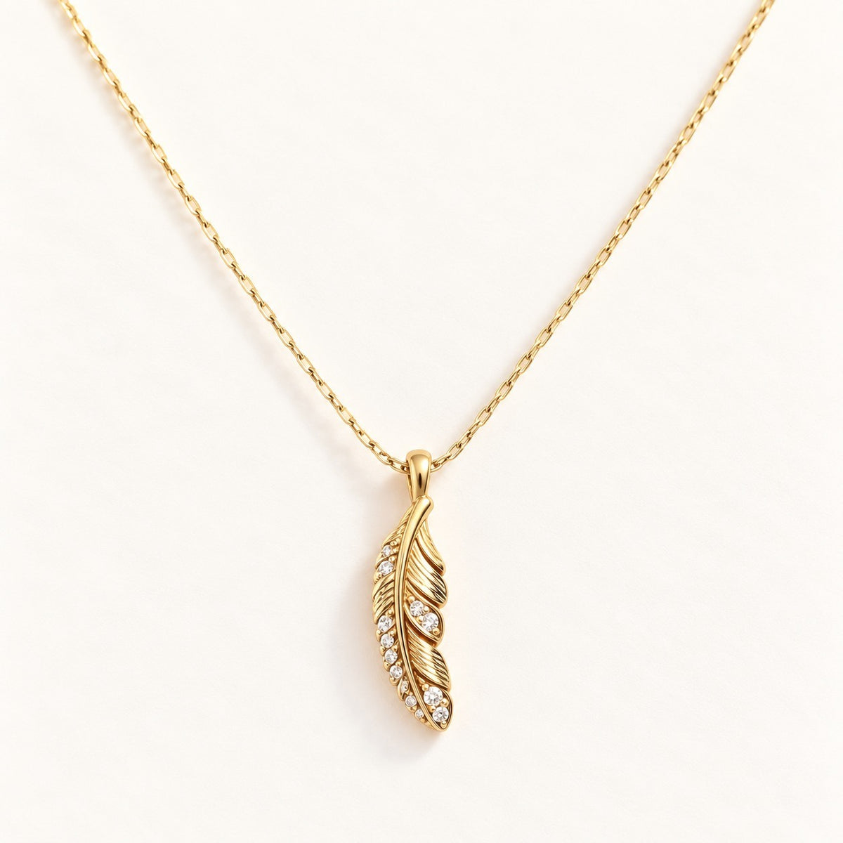 Crystal Feather Necklace on a cream background
