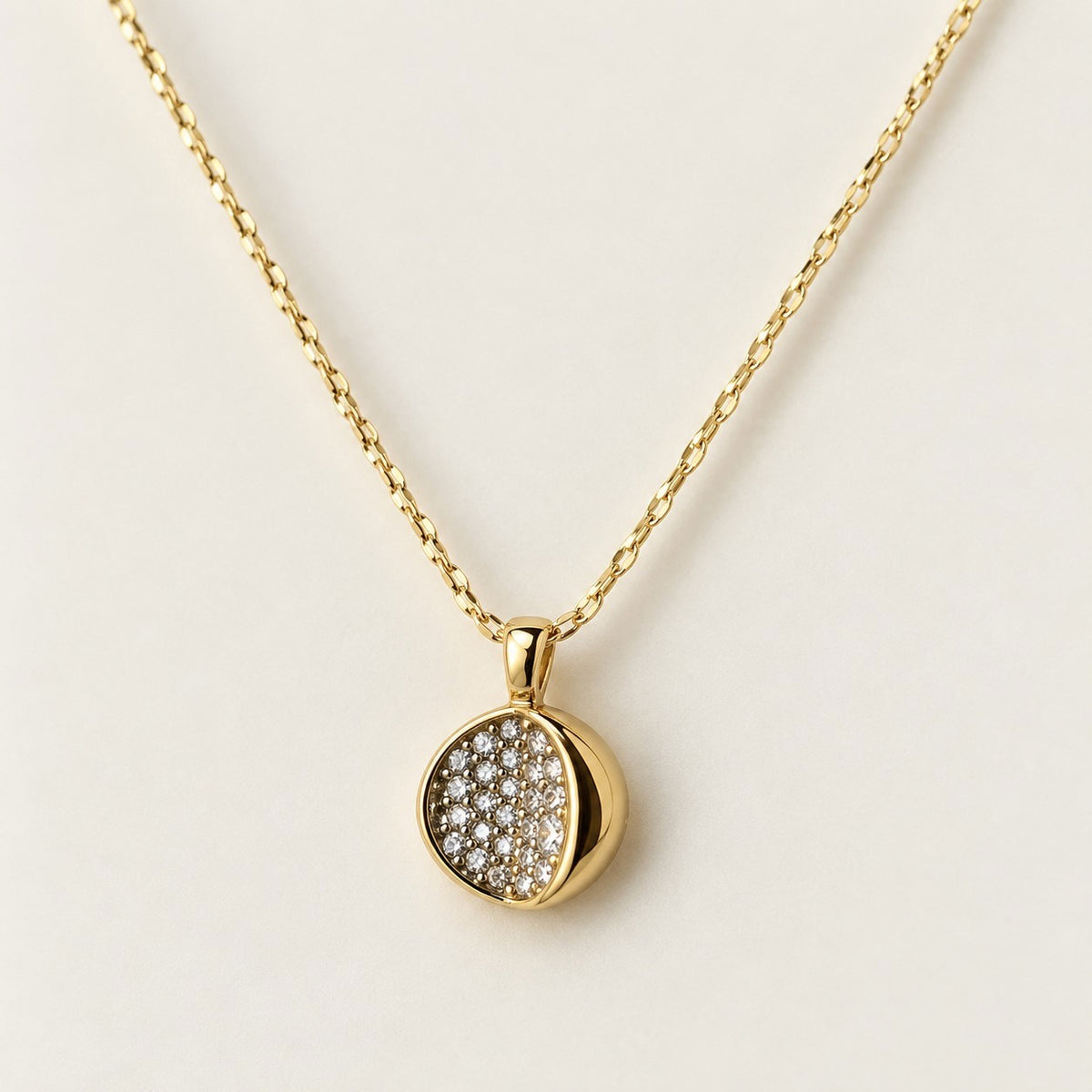 Crystal Pave Orb Necklace on a cream background