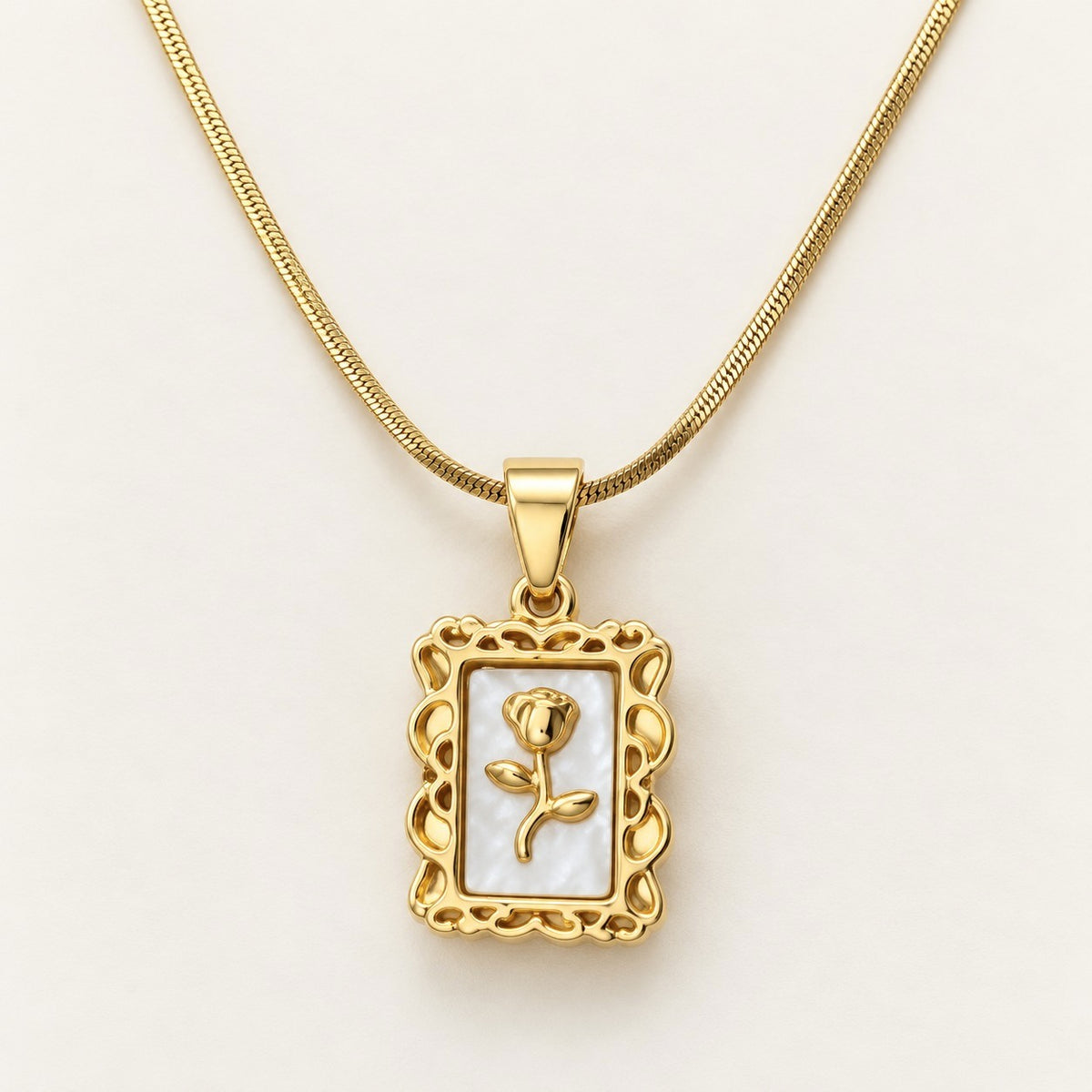 Rose Frame Pendant Necklace on a cream background