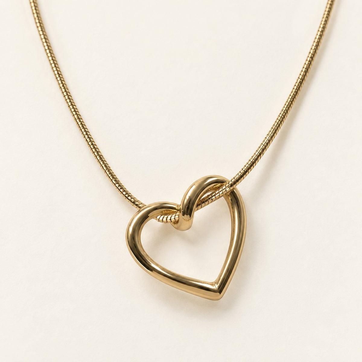Open Heart Snake Chain Necklace product photo on cream